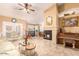 Spacious living room with decorative fireplace and French doors at 6722 W Piute Ave, Glendale, AZ 85308