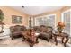 Living room with ornate furniture and large windows at 6722 W Piute Ave, Glendale, AZ 85308