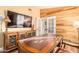Spacious home office with wood-paneled walls and large desk at 6722 W Piute Ave, Glendale, AZ 85308