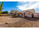 Backyard view of home with gravel and patio at 852 W Palo Verde St, Gilbert, AZ 85233