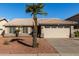 One-story house with tan colored exterior, tile roof, and attached garage at 852 W Palo Verde St, Gilbert, AZ 85233