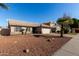 Two-story house with tan exterior, tile roof, and attached garage at 852 W Palo Verde St, Gilbert, AZ 85233