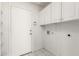 Convenient laundry room with built-in shelving and cabinets at 852 W Palo Verde St, Gilbert, AZ 85233