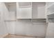 Large walk-in closet featuring custom shelving and rods at 9542 E Sunridge Dr, Sun Lakes, AZ 85248