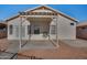 Home features a covered patio and small backyard at 11021 W Tonto Ln, Peoria, AZ 85373