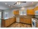 Kitchen with wood cabinets, granite counters and tile floor at 11021 W Tonto Ln, Peoria, AZ 85373