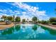 Serene community lake with fountain and lush landscaping at 11021 W Tonto Ln, Peoria, AZ 85373