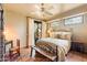 Guest bedroom with patio access and rustic decor at 11410 E Juan Tabo Rd, Scottsdale, AZ 85255