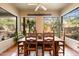 Bright breakfast nook with rustic wooden table and views to backyard at 11410 E Juan Tabo Rd, Scottsdale, AZ 85255