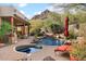 Inviting pool and spa with a mountain backdrop at 11410 E Juan Tabo Rd, Scottsdale, AZ 85255