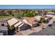 Aerial view of houses with tile roofs and desert landscaping at 11553 W Sonoran Ct, Surprise, AZ 85378