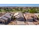 Aerial view of houses with tile roofs and desert landscaping at 11553 W Sonoran Ct, Surprise, AZ 85378