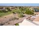 Aerial view showing a golf course and houses at 11553 W Sonoran Ct, Surprise, AZ 85378