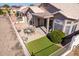 Backyard with patio furniture and artificial turf at 11553 W Sonoran Ct, Surprise, AZ 85378