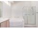 Bathroom with shower, bathtub, and vanity with double sinks at 11553 W Sonoran Ct, Surprise, AZ 85378