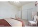 Bright bedroom with a king-size bed and two closets at 11553 W Sonoran Ct, Surprise, AZ 85378