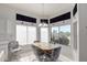 Kitchen dining area with table and chairs, overlooking backyard at 11553 W Sonoran Ct, Surprise, AZ 85378