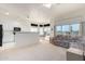 Kitchen with white cabinets and breakfast bar at 11553 W Sonoran Ct, Surprise, AZ 85378