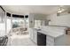 Open kitchen with breakfast nook and view into living room at 11553 W Sonoran Ct, Surprise, AZ 85378
