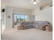 Living room with sectional sofa and sliding glass doors at 11553 W Sonoran Ct, Surprise, AZ 85378