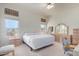 Spacious main bedroom with king-size bed and backyard access at 11553 W Sonoran Ct, Surprise, AZ 85378