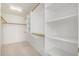 Large walk-in closet with ample shelving and hanging rods at 11553 W Sonoran Ct, Surprise, AZ 85378