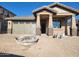 New single-story home with a two-car garage and desert landscaping at 13250 W Eagle Feather Rd, Peoria, AZ 85383