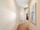 Bright hallway with arched doorway and window with shutters at 20802 N Grayhawk Dr # 1087, Scottsdale, AZ 85255