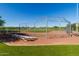 Community baseball field with bleachers and chain link fence at 21325 N 260Th Ln, Buckeye, AZ 85396