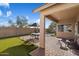 Home's backyard with patio, pool, and seating area at 21995 N 76Th Ln, Peoria, AZ 85383