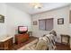 Relaxing bedroom with a comfortable recliner chair at 21995 N 76Th Ln, Peoria, AZ 85383