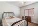 Charming bedroom with antique wooden bed and dresser at 21995 N 76Th Ln, Peoria, AZ 85383