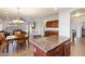 Bright dining area with a wood table and chairs near the kitchen at 21995 N 76Th Ln, Peoria, AZ 85383