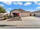 Single-story house with attached garage and landscaped front yard at 21995 N 76Th Ln, Peoria, AZ 85383