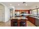 Kitchen boasts granite countertops, stainless steel appliances, and an island with seating at 21995 N 76Th Ln, Peoria, AZ 85383