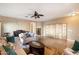 Bright living room with tiled floors, comfy seating, and a decorative screen at 21995 N 76Th Ln, Peoria, AZ 85383