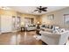 Living room with tiled floors, neutral decor, and ample natural light at 21995 N 76Th Ln, Peoria, AZ 85383