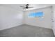 Spacious bedroom with grey carpet and ceiling fan at 2415 N 71St St # D, Scottsdale, AZ 85257