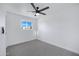 Well-lit bedroom featuring grey carpet and ceiling fan at 2415 N 71St St # D, Scottsdale, AZ 85257