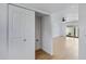 Bright hallway with light wood floors and access to laundry and living areas at 2415 N 71St St # D, Scottsdale, AZ 85257