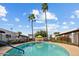 Inviting community pool with patio furniture and lush landscaping at 2415 N 71St St # D, Scottsdale, AZ 85257