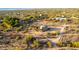 Aerial view of a home with a spacious lot and desert landscape in the background at 27852 N 79Th St, Scottsdale, AZ 85266