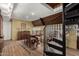 Elegant dining room with a spiral staircase and wood floors at 27852 N 79Th St, Scottsdale, AZ 85266