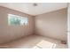 Simple bedroom with tiled floors and window at 310 W 14Th St, Eloy, AZ 85131