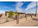 House exterior showcasing a well-maintained yard and a security fence at 310 W 14Th St, Eloy, AZ 85131