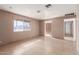 Bright living room featuring tile floors and access to other rooms at 310 W 14Th St, Eloy, AZ 85131