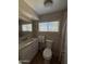 Bathroom with a vanity, toilet and window at 4065 E University Dr # 373, Mesa, AZ 85205