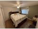 Second bedroom with king-size bed and wood floors at 4065 E University Dr # 373, Mesa, AZ 85205
