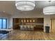 Well-equipped community kitchen with light wood cabinets at 4065 E University Dr # 373, Mesa, AZ 85205