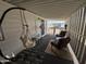 Relaxing covered patio with hammock, chairs, and side tables at 4065 E University Dr # 373, Mesa, AZ 85205